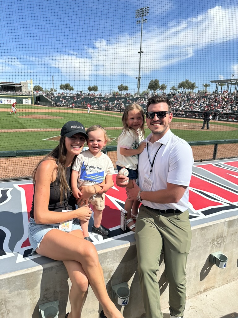 Dr. Howard with family at a baseball game