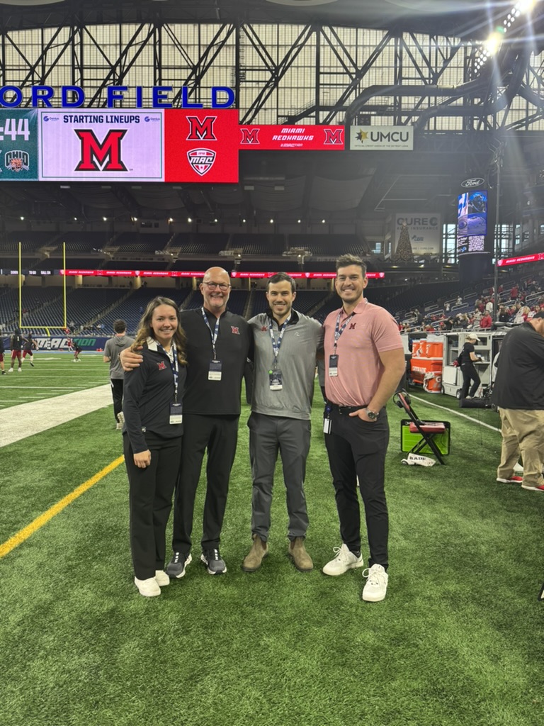 Dr. Howard with colleagues at Ford Field