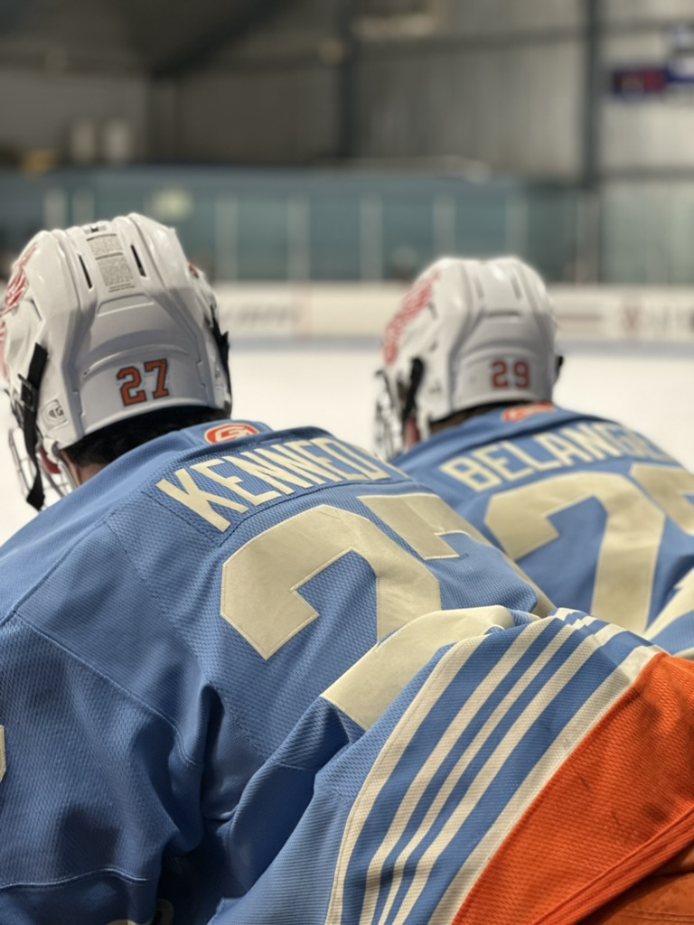 Little Caesars hockey players on the ice
